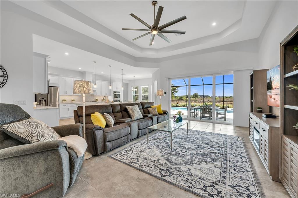 3410 Wellfleet Lane Naples, FL 34114 - Photo 5 of 28 a living room with furniture and a wooden floor