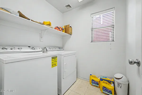 a utility room with dryer and washer