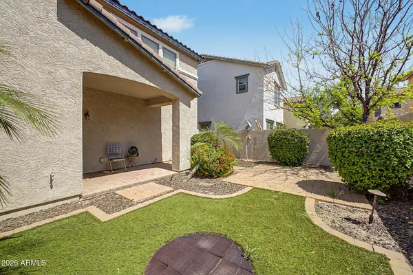 a view of a backyard with potted plants