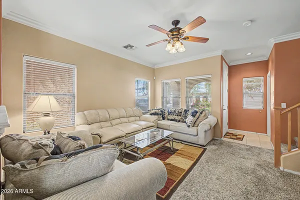 a living room with furniture and a large window