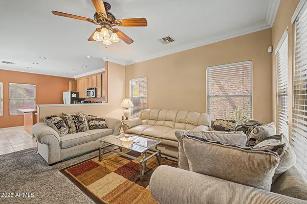a living room with furniture and a large window