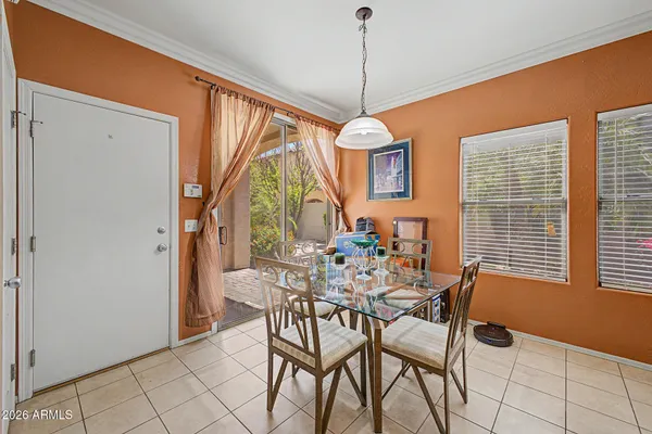 a dining room with furniture and window