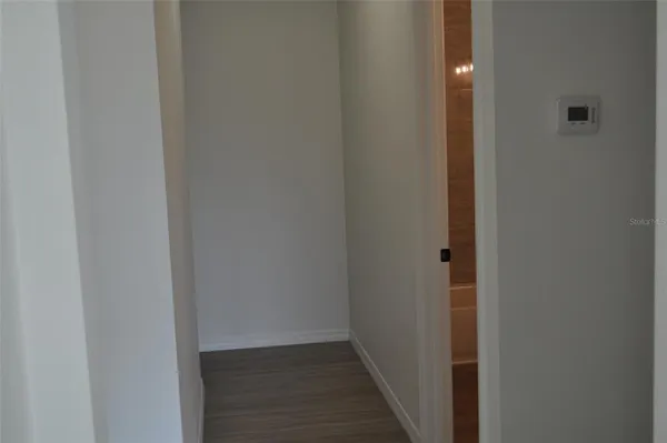 a view of hallway with closet
