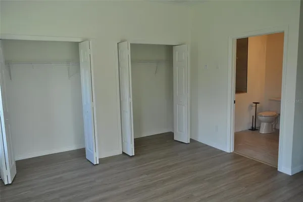 wooden floor and closet in a room