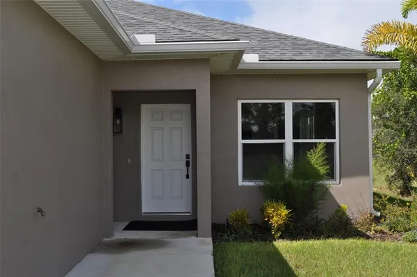 a house with garden in front of it
