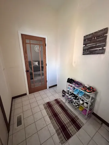 a living room with furniture and a rug