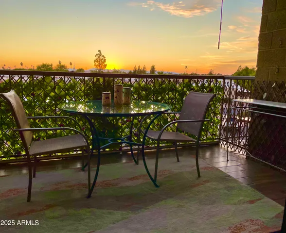 a view of a balcony with chairs