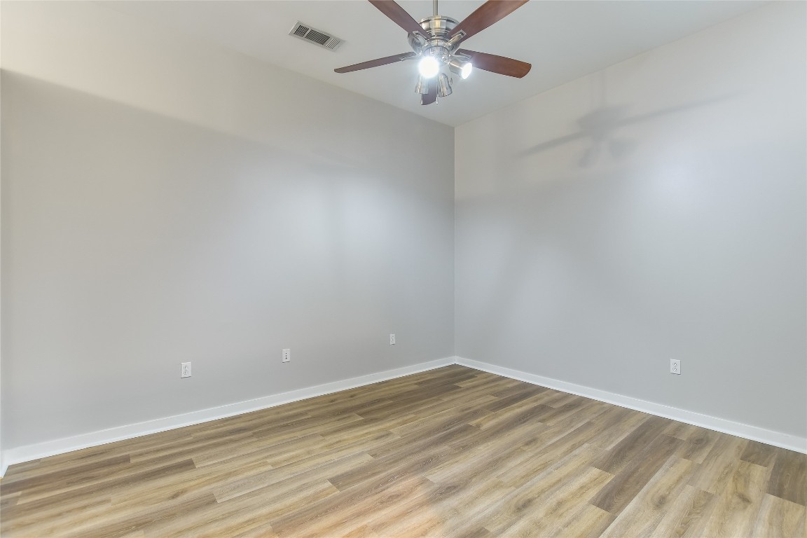 507 Sabine Street, Unit 709 Austin, TX 78701 - Photo 10 of 13 Spare room featuring a ceiling fan and light wood-type flooring