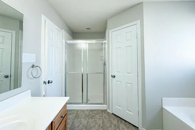 a bathroom with a sink and mirror