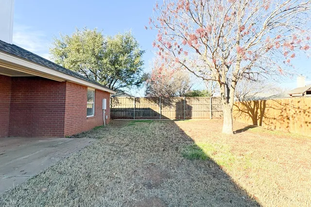 a view of a yard with trees