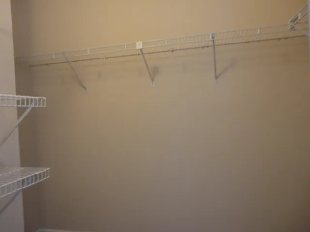a view of a room with racks on the wall