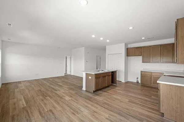 a view of kitchen with wooden floor