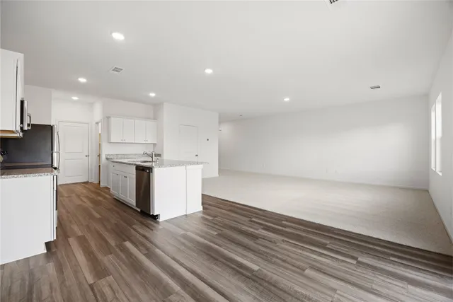 a view of kitchen with wooden floor