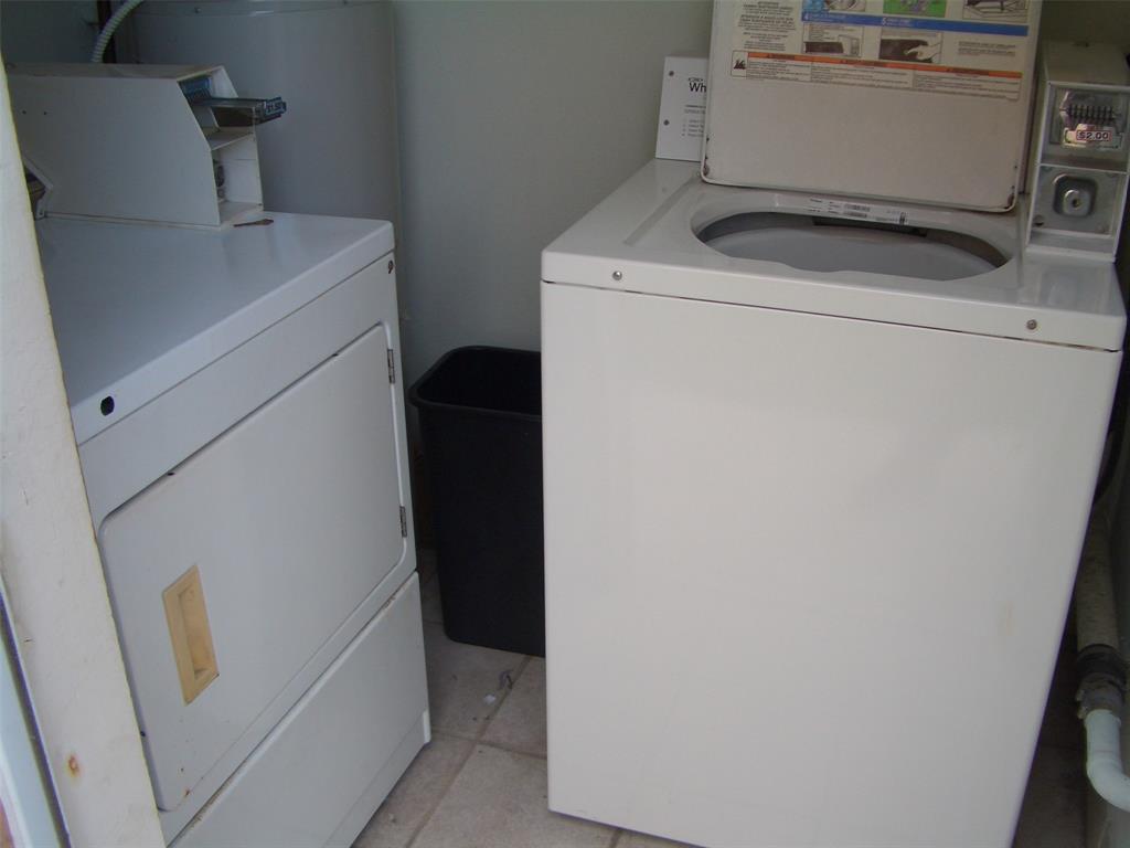2737 Northeast 28th Street, Unit 7W Lighthouse Point, FL 33064 - Photo 14 of 15 a utility room with dryer and washer