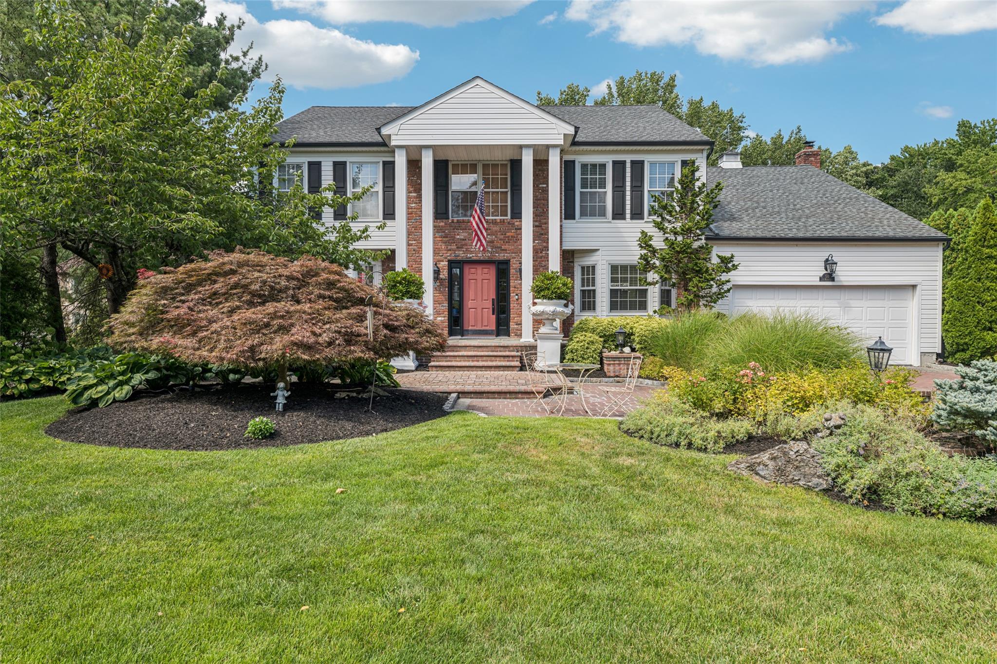 50 I U Willets Road North Hills, NY 11576 - Photo 1 of 1 a front view of a house with a garden
