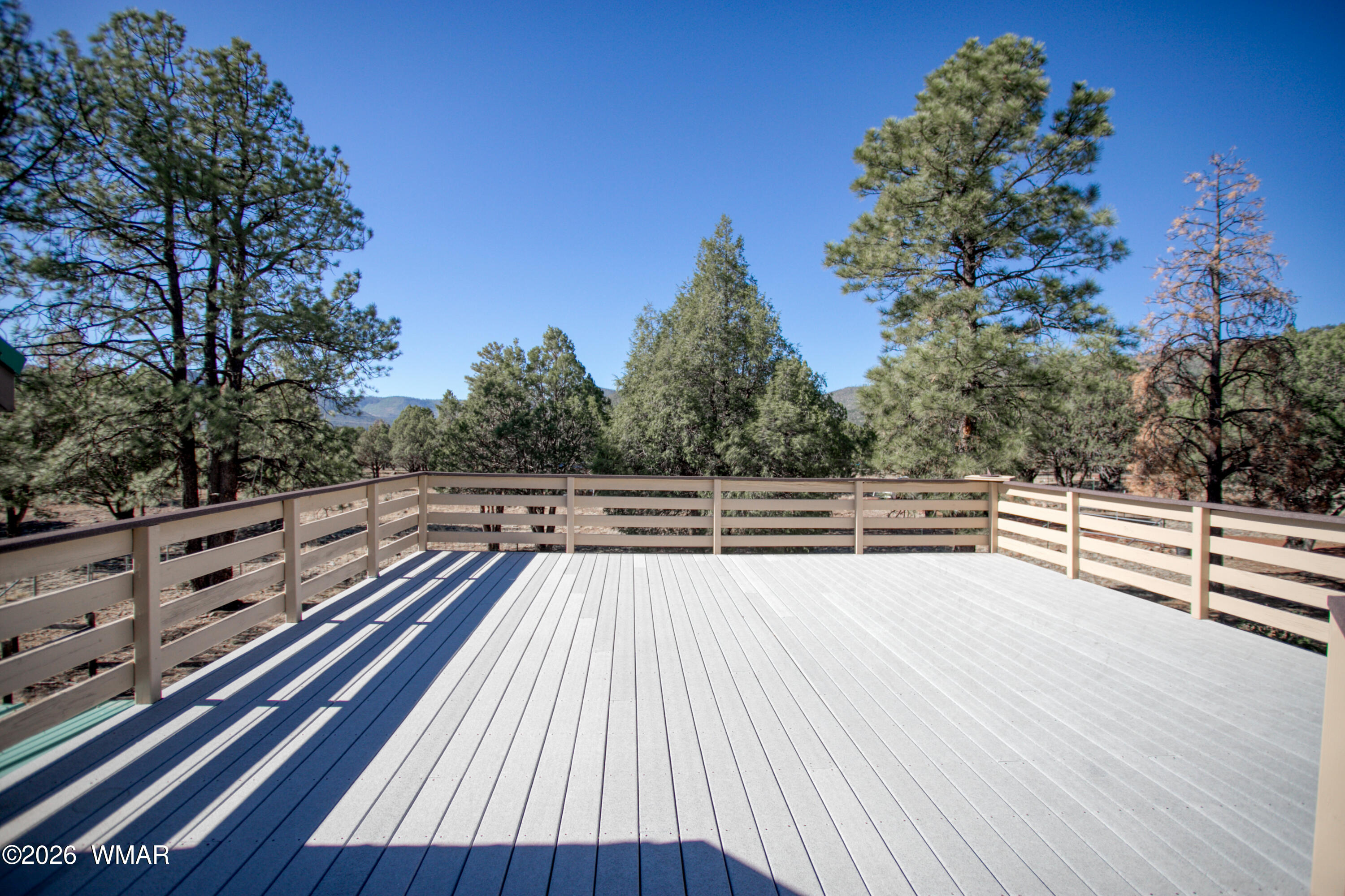 19 County Road Show Low, AZ 85901 - Photo 2 of 43 a view of balcony with wooden floor and trees