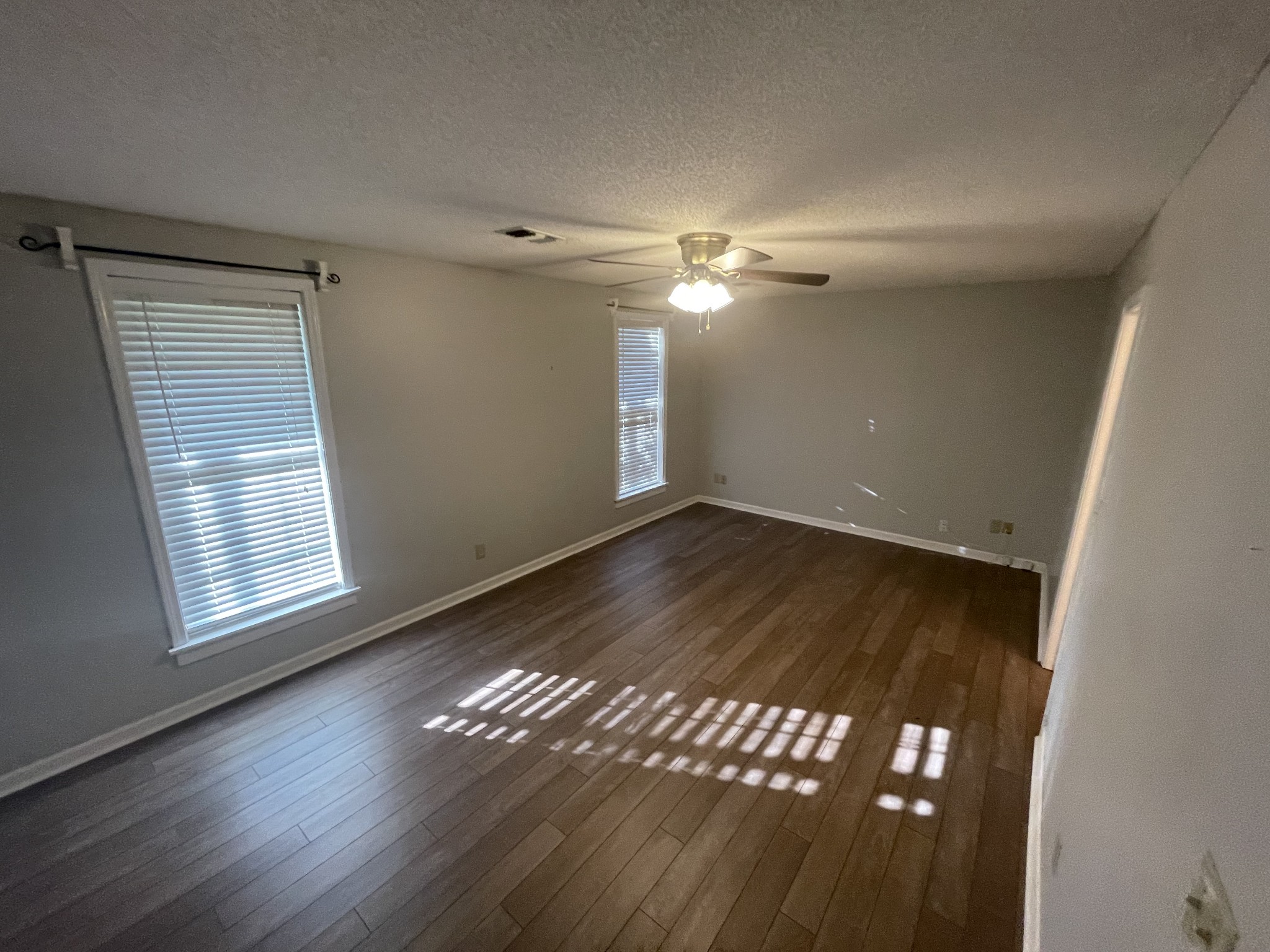 109 Walnut Grove Road Lebanon, TN 37090 - Photo 11 of 19 a view of an empty room with wooden floor and a window