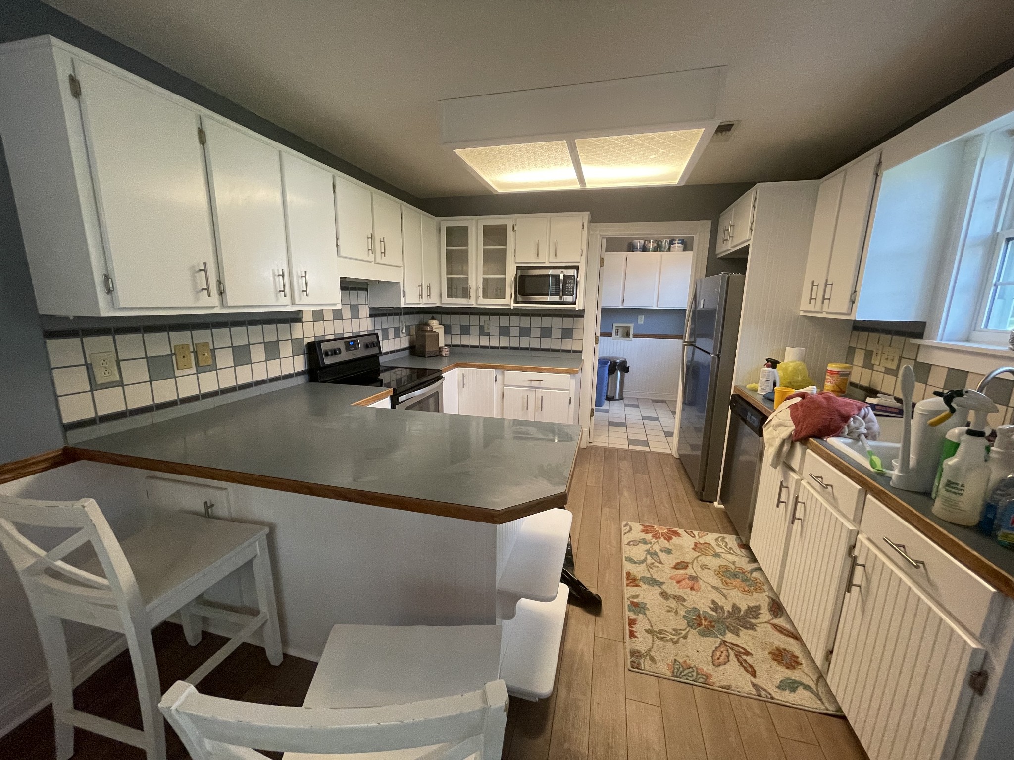 109 Walnut Grove Road Lebanon, TN 37090 - Photo 8 of 19 a kitchen with a sink a stove and cabinets