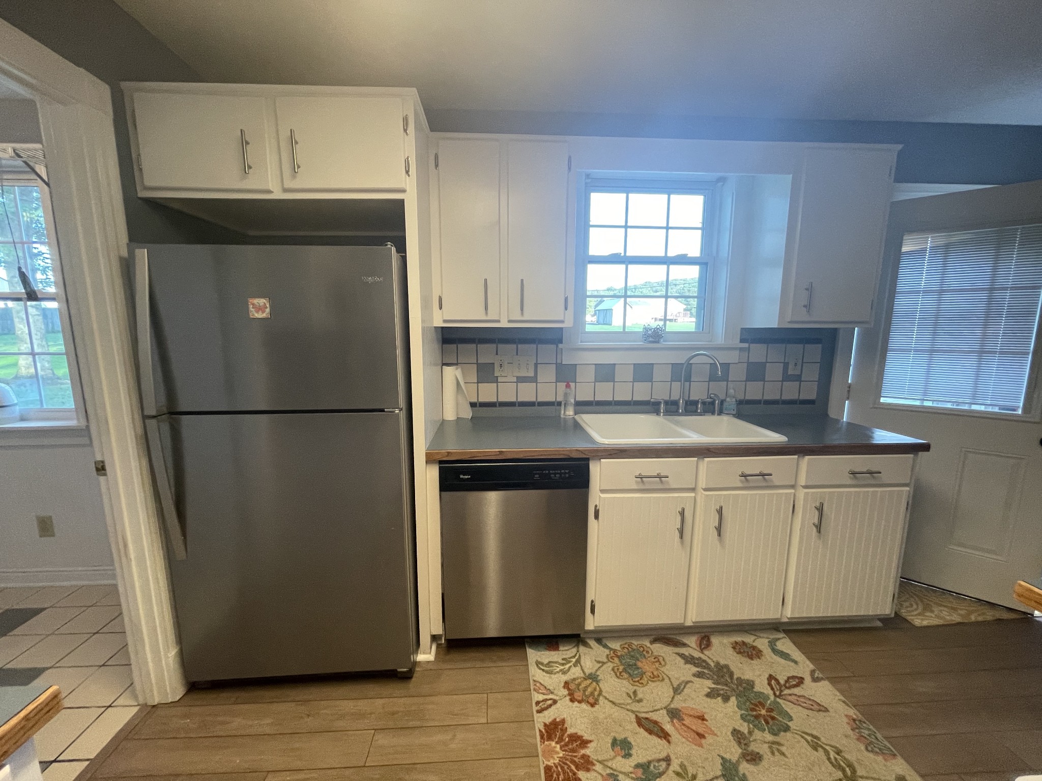 109 Walnut Grove Road Lebanon, TN 37090 - Photo 10 of 19 a kitchen with stainless steel appliances granite countertop a refrigerator sink and white cabinets