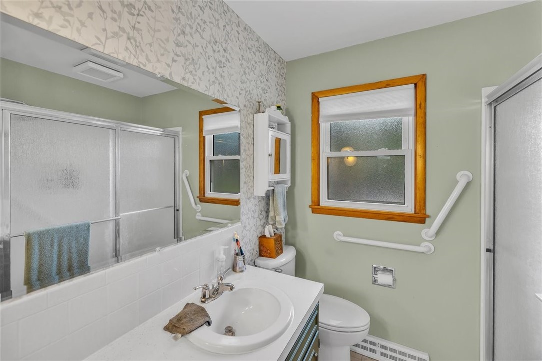 2220 West Ravina Park Road Decatur, IL 62526 - Photo 22 of 36 a bathroom with a sink and a mirror