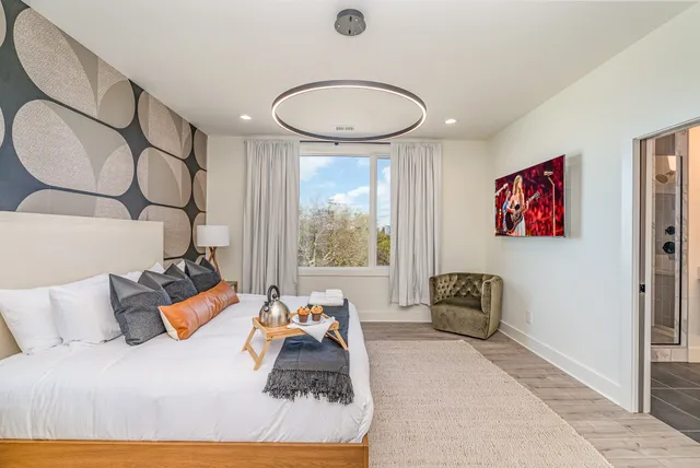 a bedroom with furniture and a window