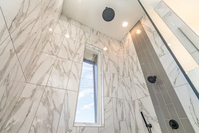 a bathroom with a sink and shower curtain