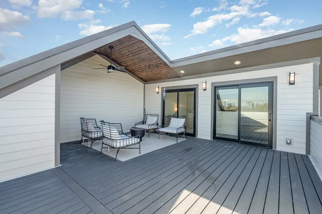 a view of a livingroom with lounge chair and front door