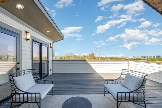 a view of a chairs and table on the deck