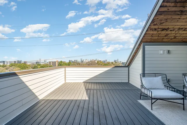 a view of a balcony and chairs