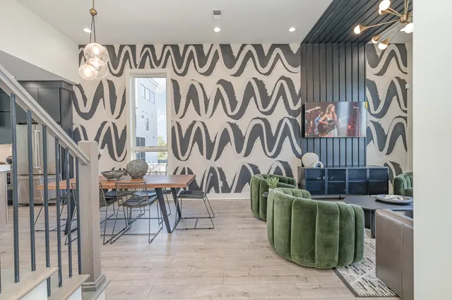 wooden floor with table and chairs