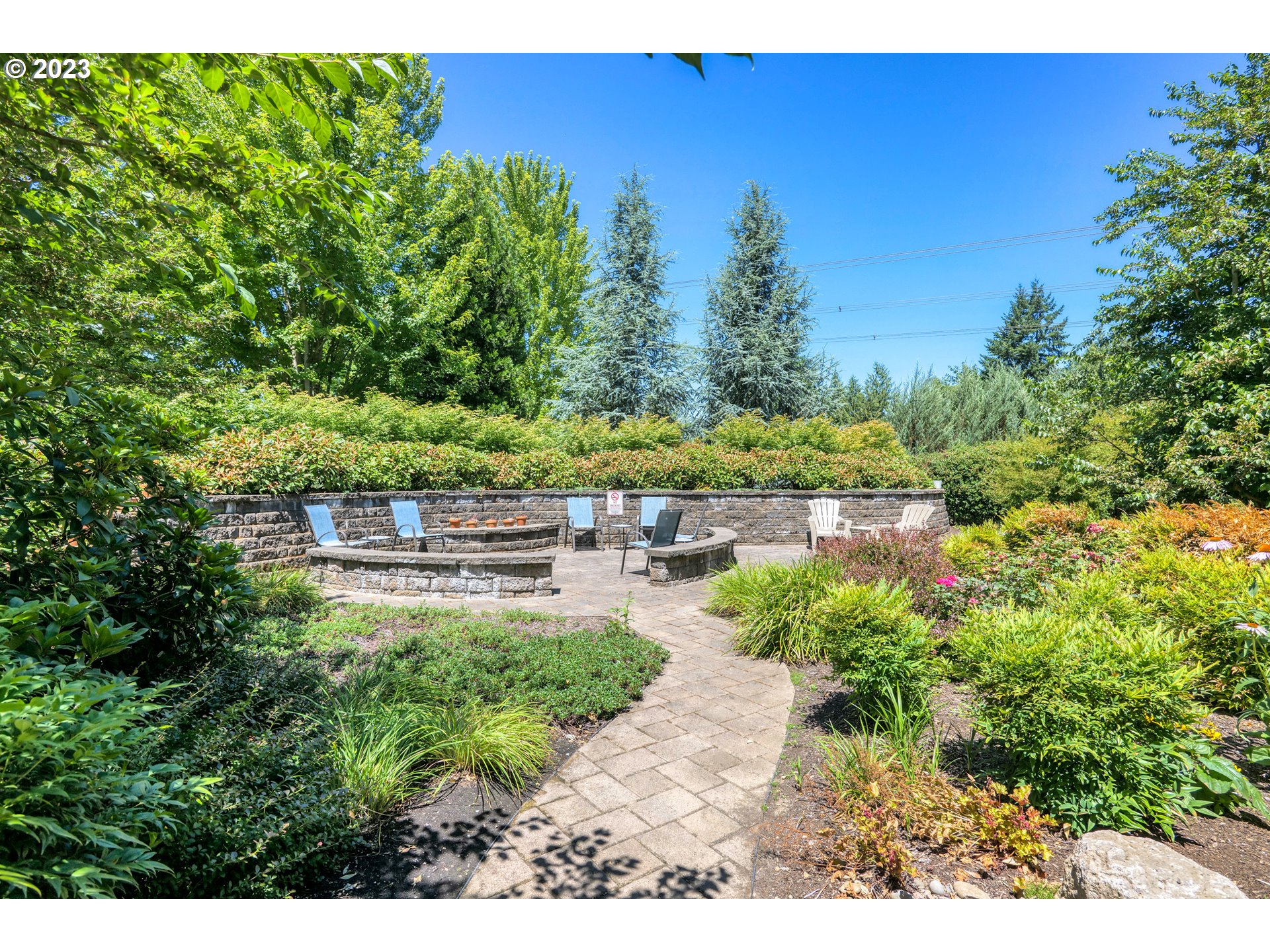 20512 Southwest Roy Rogers Road, Unit 112 Sherwood, OR 97140 - Photo 3 of 18 a backyard of a house with lots of green space