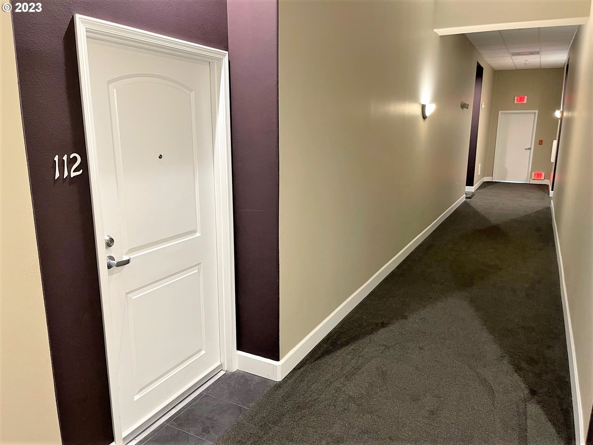 20512 Southwest Roy Rogers Road, Unit 112 Sherwood, OR 97140 - Photo 5 of 18 view of a hallway with wooden floor