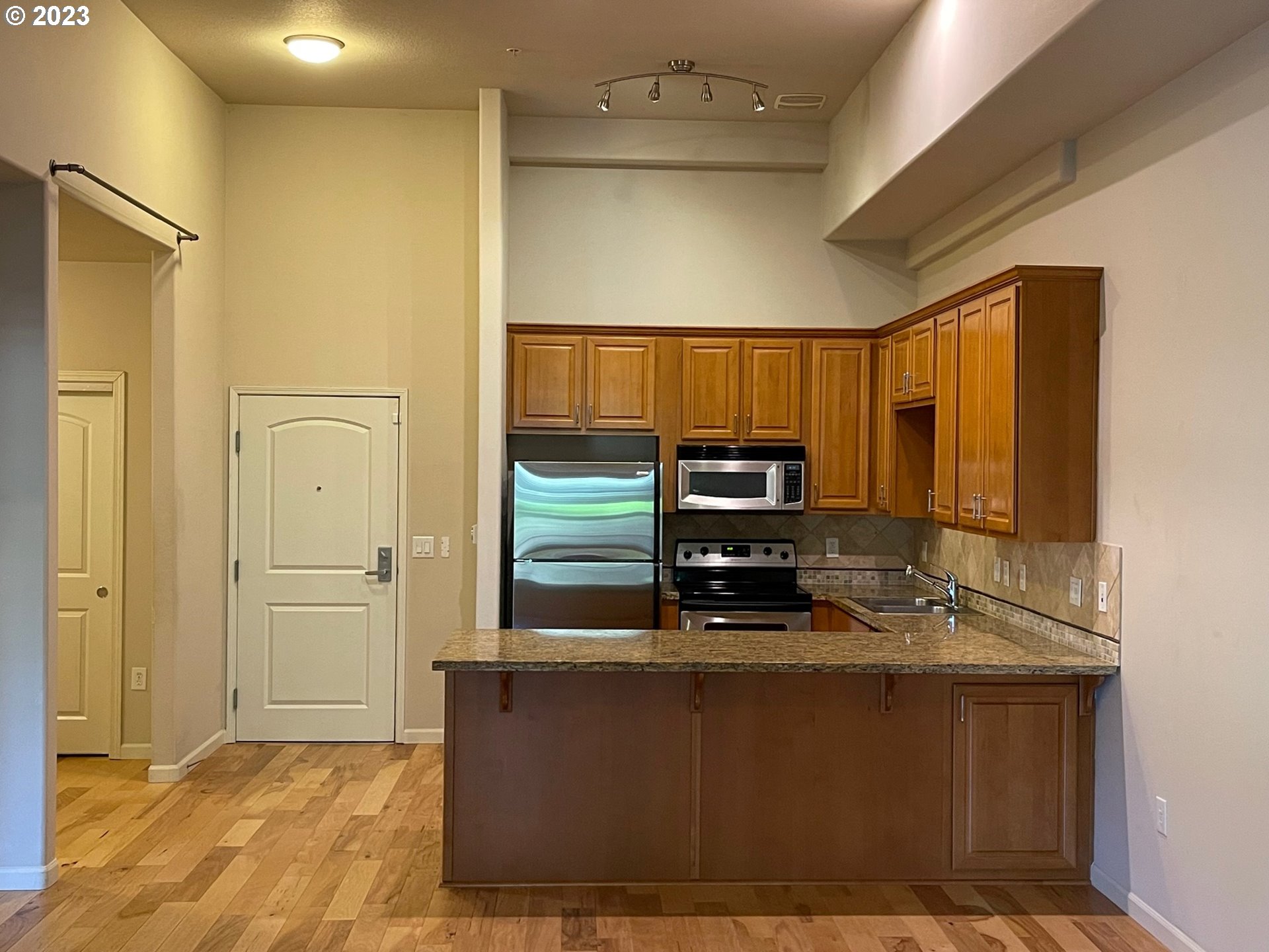 20512 Southwest Roy Rogers Road, Unit 112 Sherwood, OR 97140 - Photo 7 of 18 a view of kitchen with cabinets