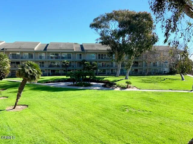 a bedroom with a large bed and a large window