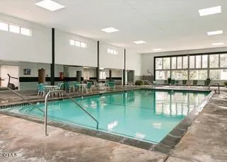 a room with lots of table and chairs