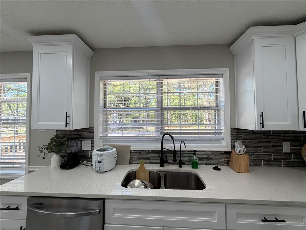 934 Bay Ridge Drive Lawrenceville, GA 30045 - Photo 45 of 78 a kitchen with a sink and a window