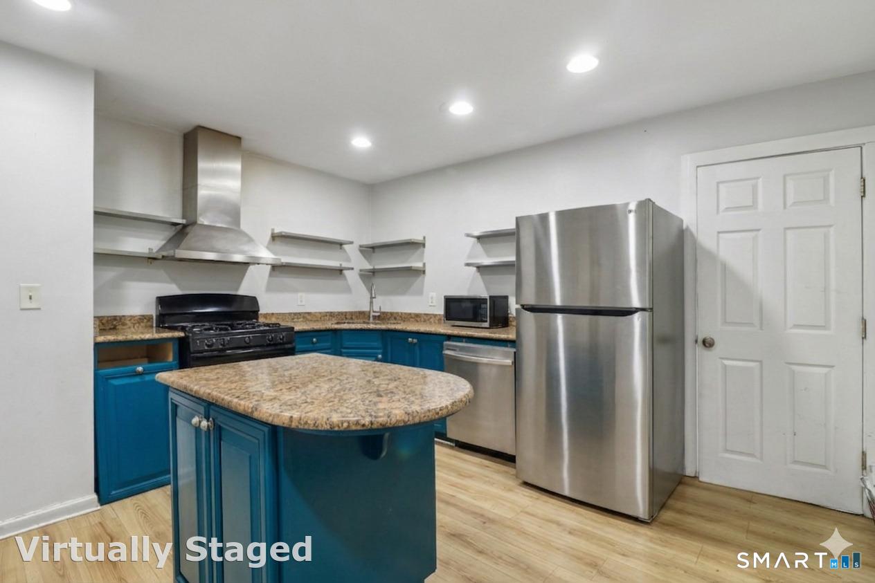 37 Manhan Street Waterbury, CT 06710 - Photo 1 of 19 a kitchen with stainless steel appliances granite countertop a refrigerator a sink and a stove