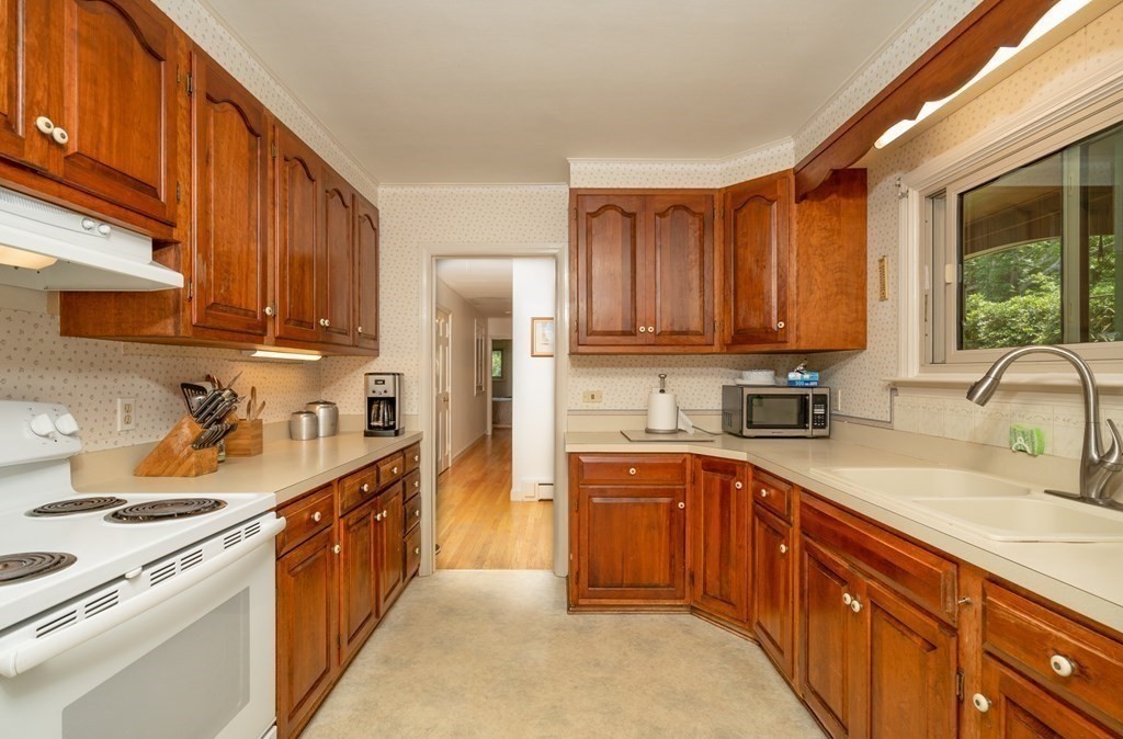 26 Park Road Monson, MA 01057 - Photo 8 of 32 a kitchen with a sink a stove and refrigerator