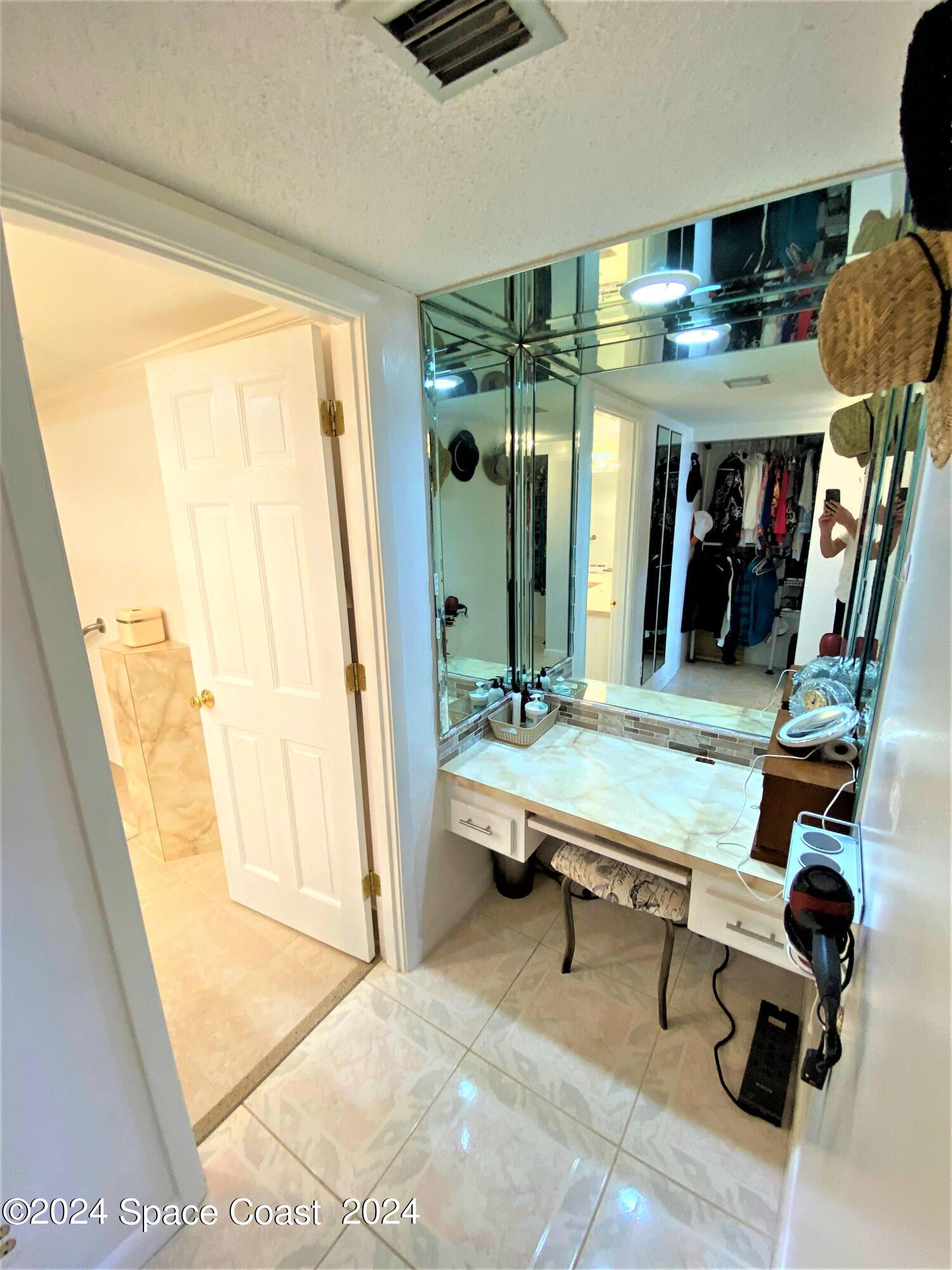 2100 North Atlantic Avenue, Unit 908 Cocoa Beach, FL 32931 - Photo 9 of 17 a room with musical instruments