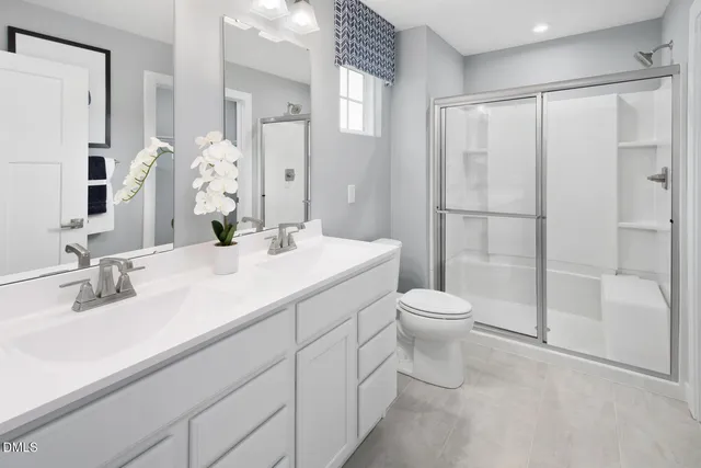 a en suite bathroom with a sink and a mirror