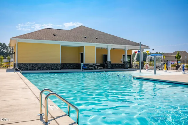 a view of a swimming pool with a patio