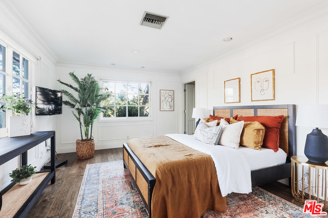15475 Milldale Drive Los Angeles, CA 90077 - Photo 19 of 22 a bedroom with a large bed and a window