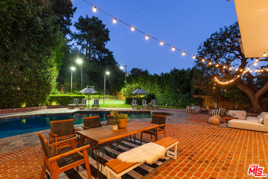 15475 Milldale Drive Los Angeles, CA 90077 - Photo 21 of 22 a view of a patio with swimming pool