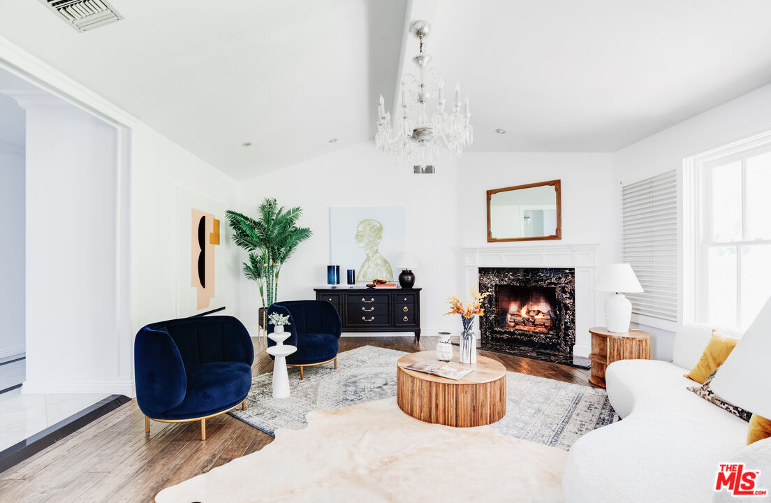 15475 Milldale Drive Los Angeles, CA 90077 - Photo 4 of 22 a living room with furniture and a fireplace