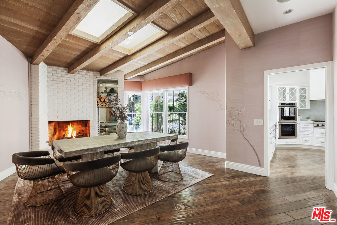 15475 Milldale Drive Los Angeles, CA 90077 - Photo 5 of 22 a living room with furniture and a fireplace