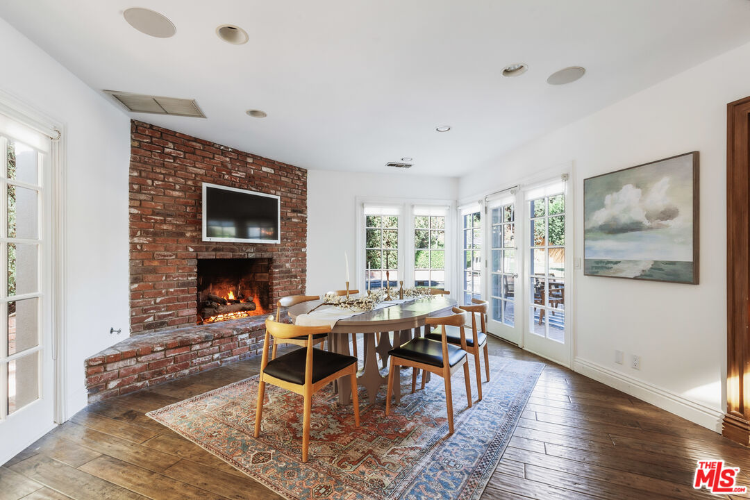 15475 Milldale Drive Los Angeles, CA 90077 - Photo 6 of 22 a view of a dining room with furniture window and wooden floor