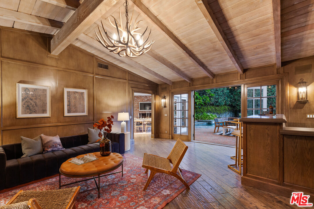 15475 Milldale Drive Los Angeles, CA 90077 - Photo 9 of 22 a living room with furniture and a wooden floor