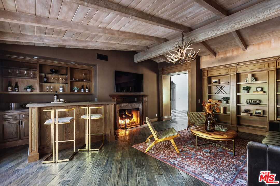 15475 Milldale Drive Los Angeles, CA 90077 - Photo 10 of 22 a living room with furniture and a fireplace