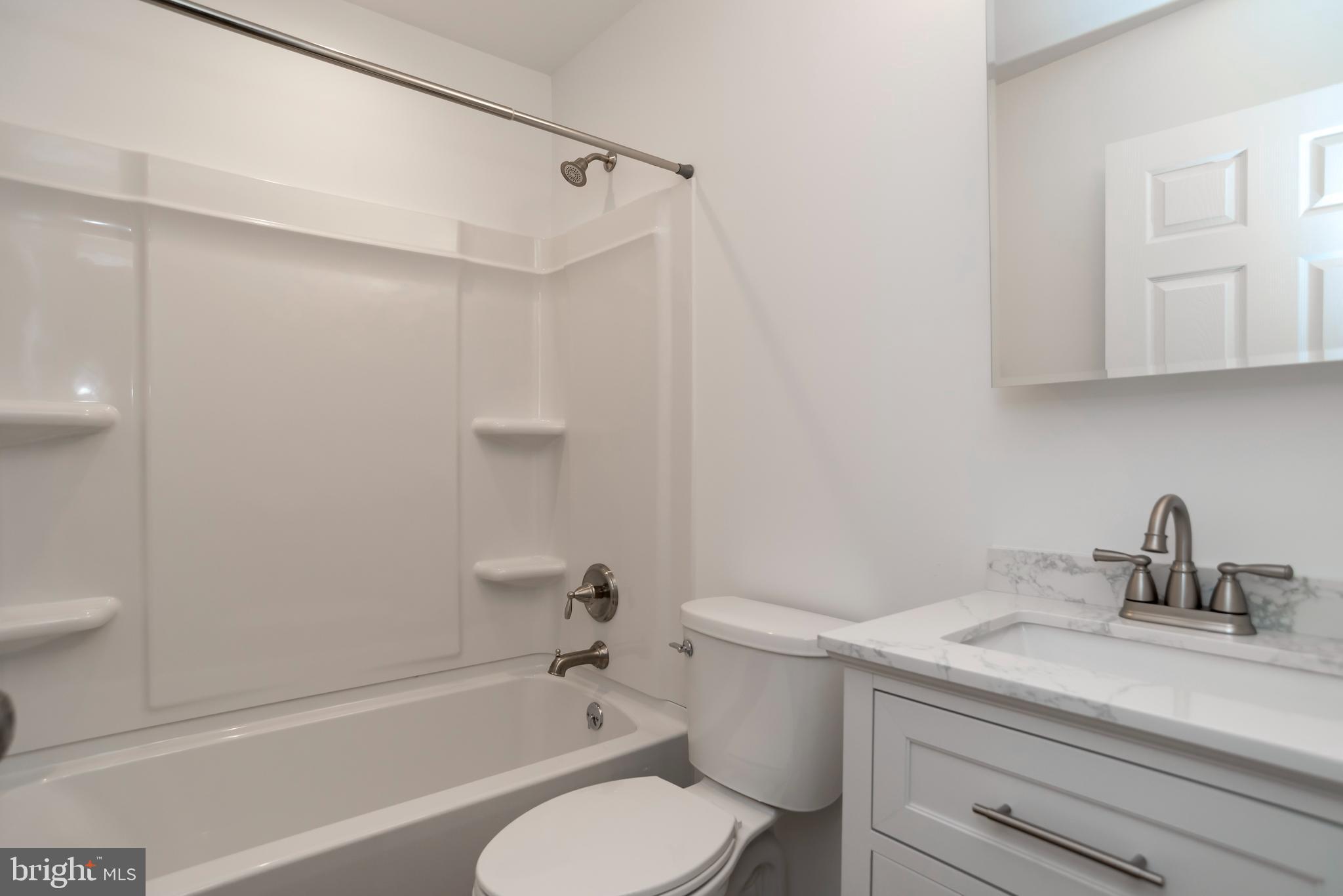 44 Elm Lane Levittown, PA 19054 - Photo 17 of 35 a bathroom with a sink toilet and shower