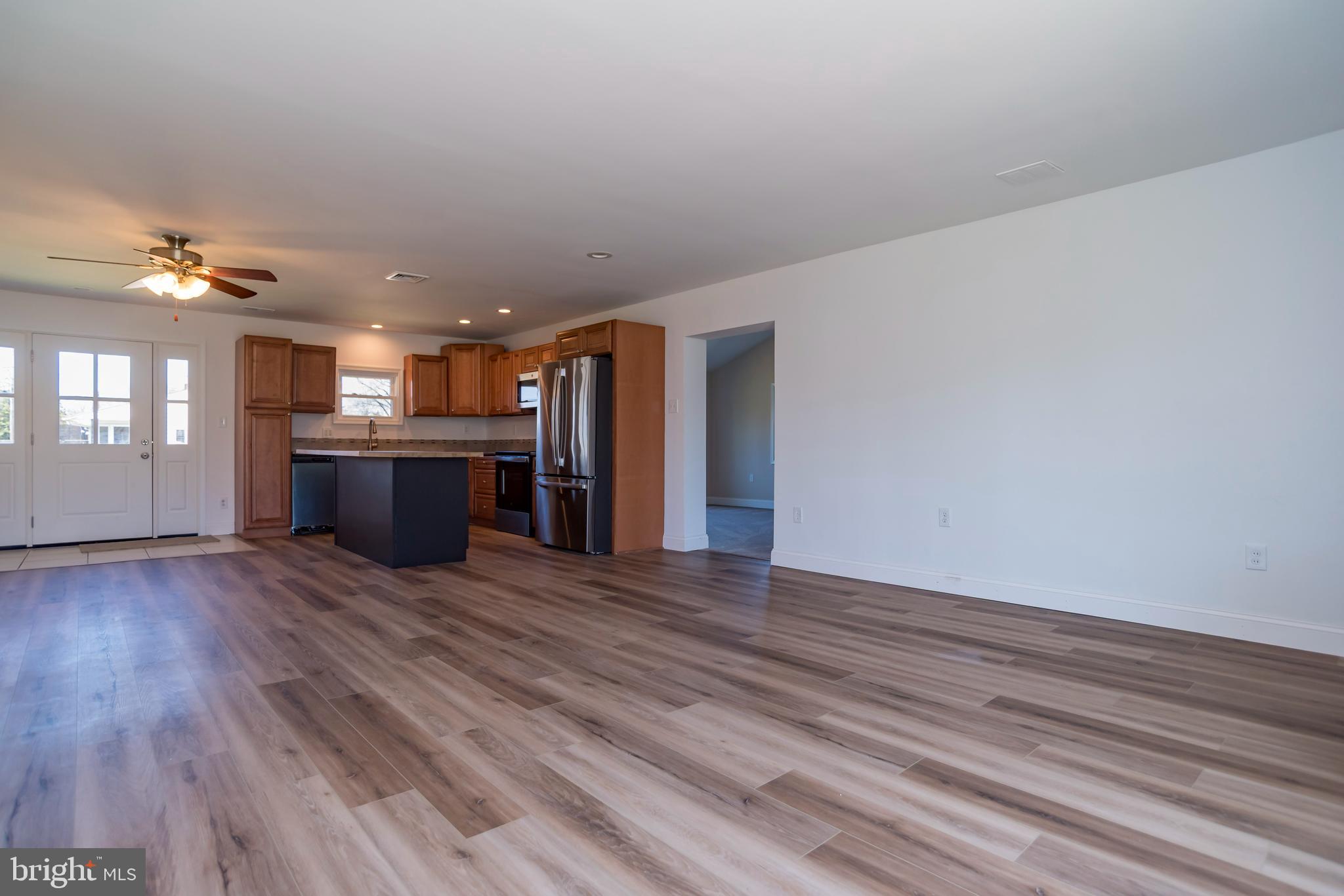 44 Elm Lane Levittown, PA 19054 - Photo 5 of 35 a view of a kitchen with a sink and a fireplace